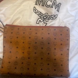 Crossbody MCM purse. Gently worn straps come off can be used as a clutch.